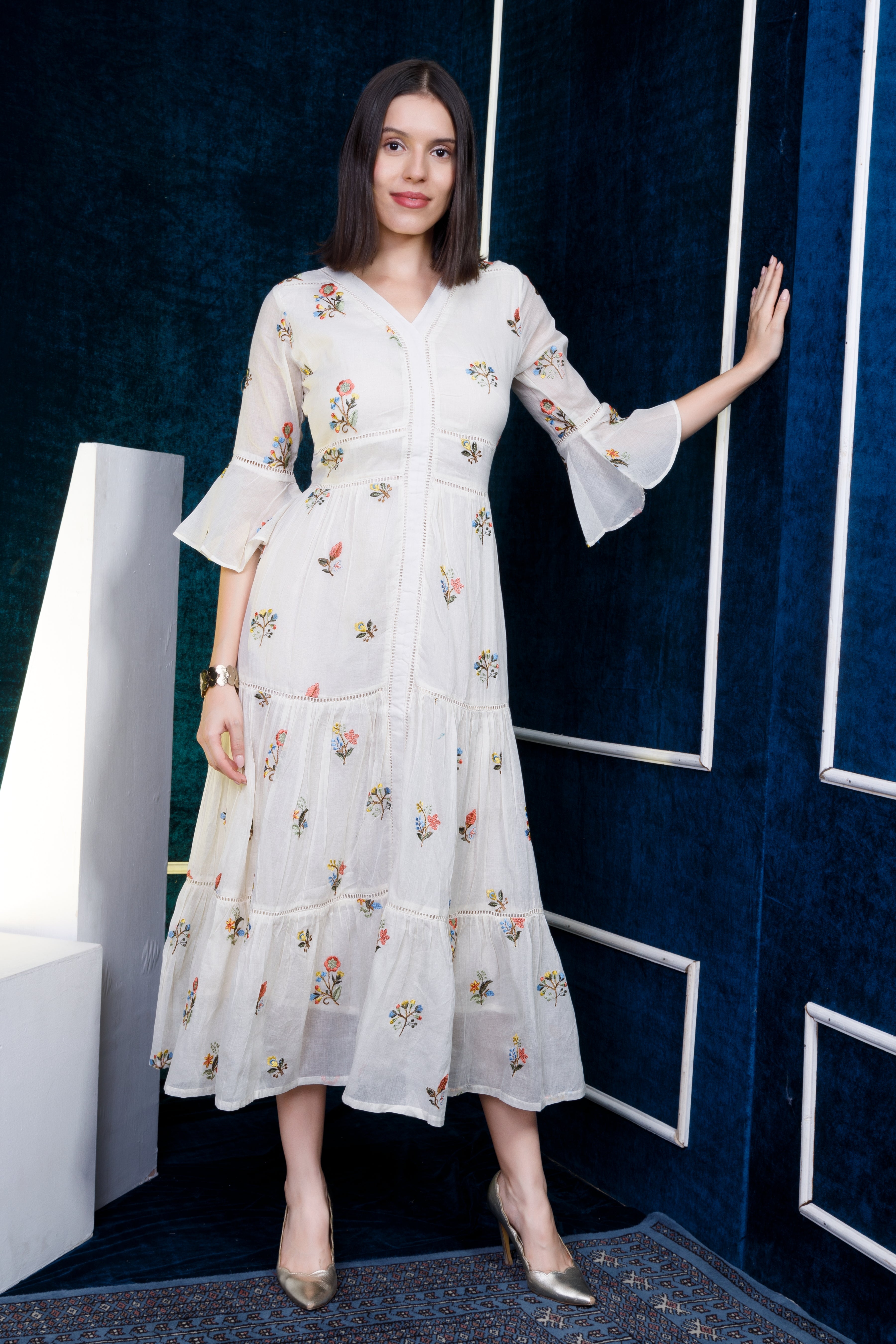 Offwhite mul dress with embroidered butis and lace detailing