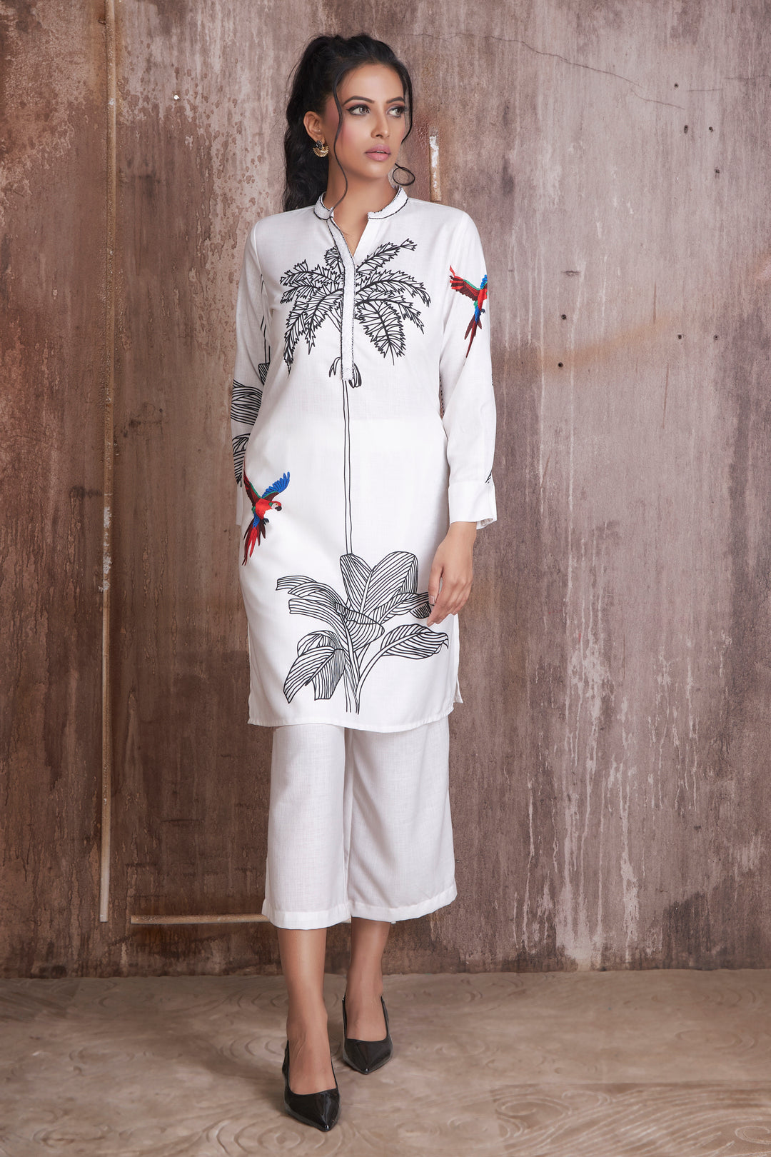 White palm tree and bird placemen print kurti with sequence collar and placket teamed with white pants