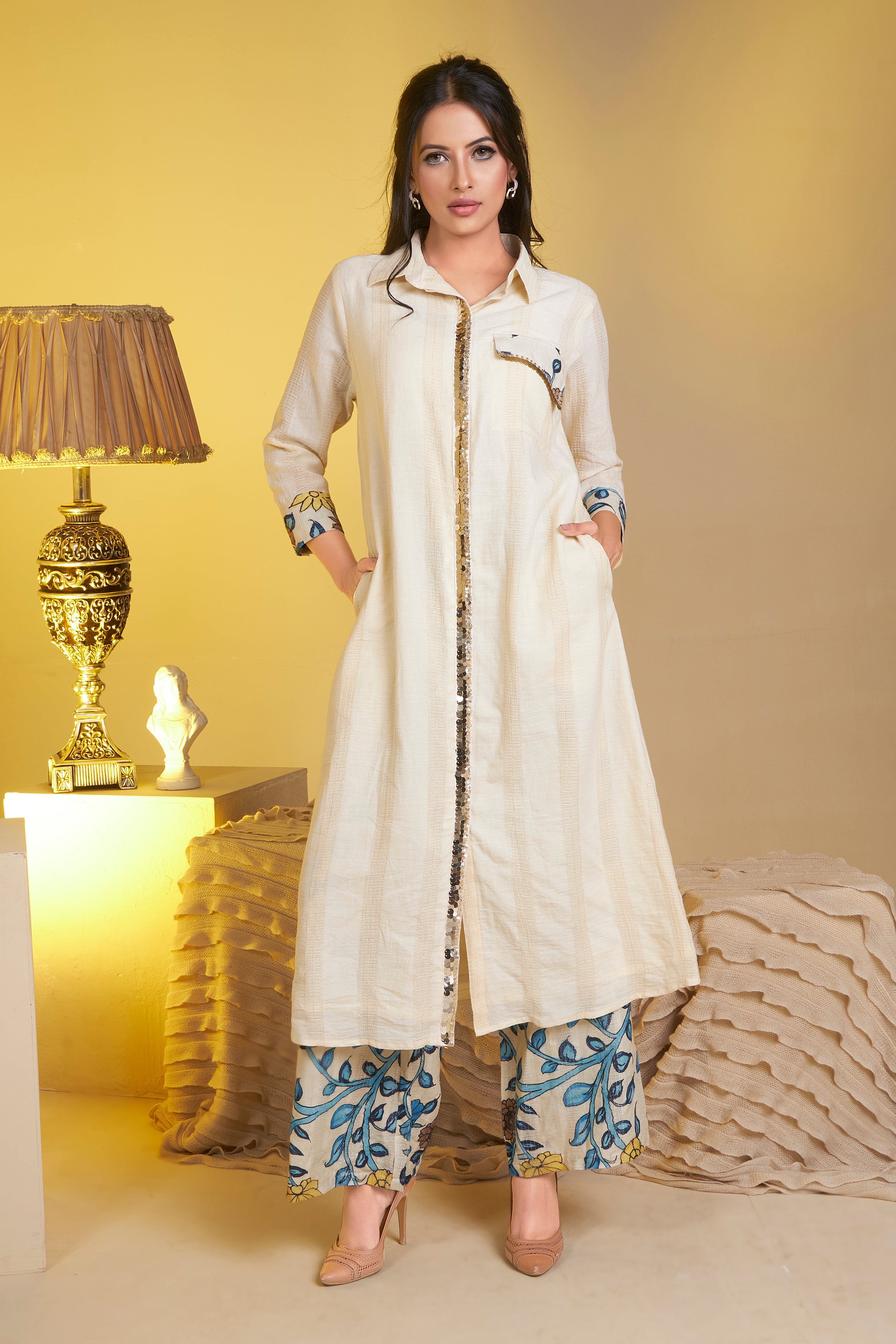 Beige pure cotton lurex textured kurta with hand sequence on the placket teamed with printed pants