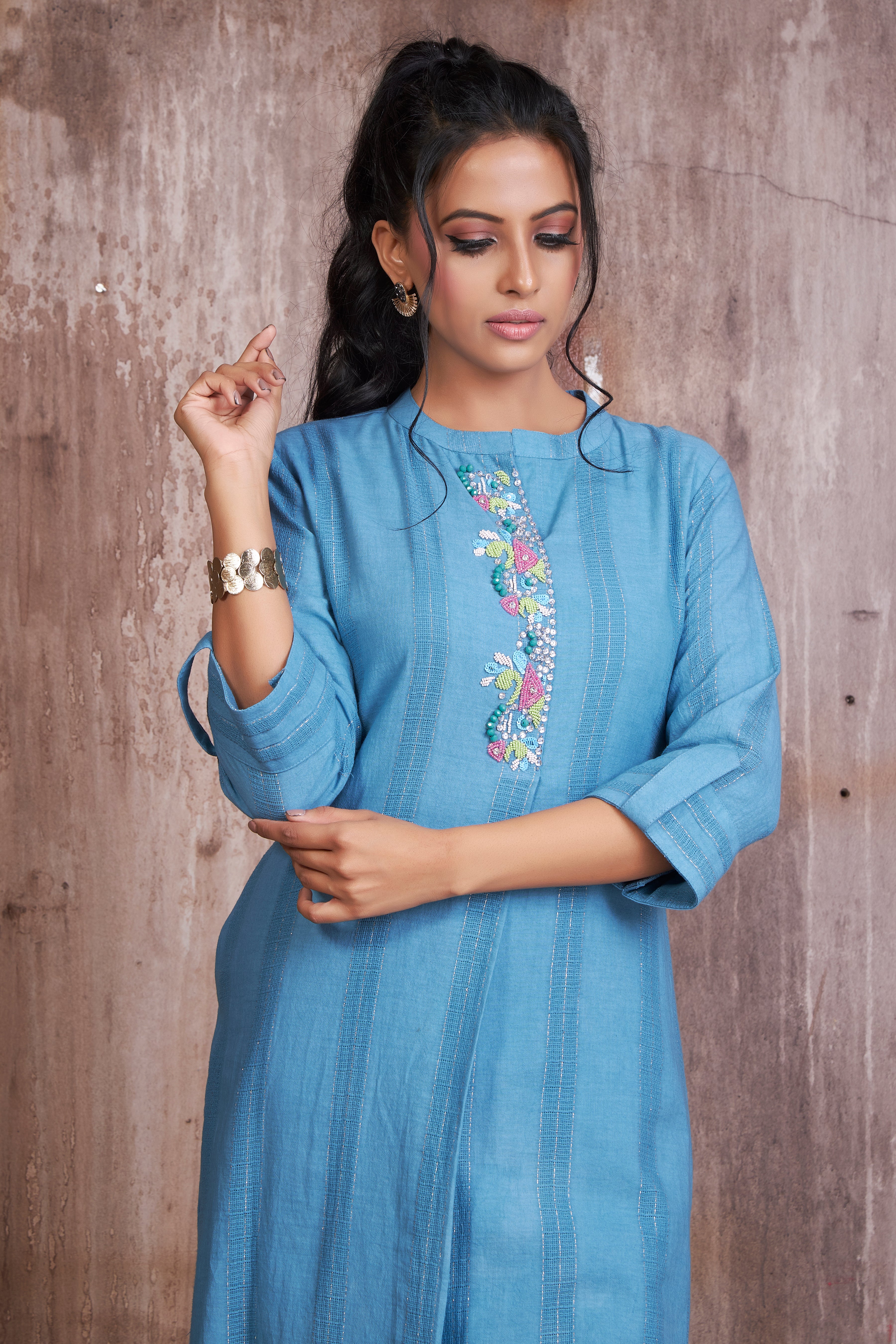 Blue pure cotton lurex textured kurta with hand embroidery teamed with printed straight pants