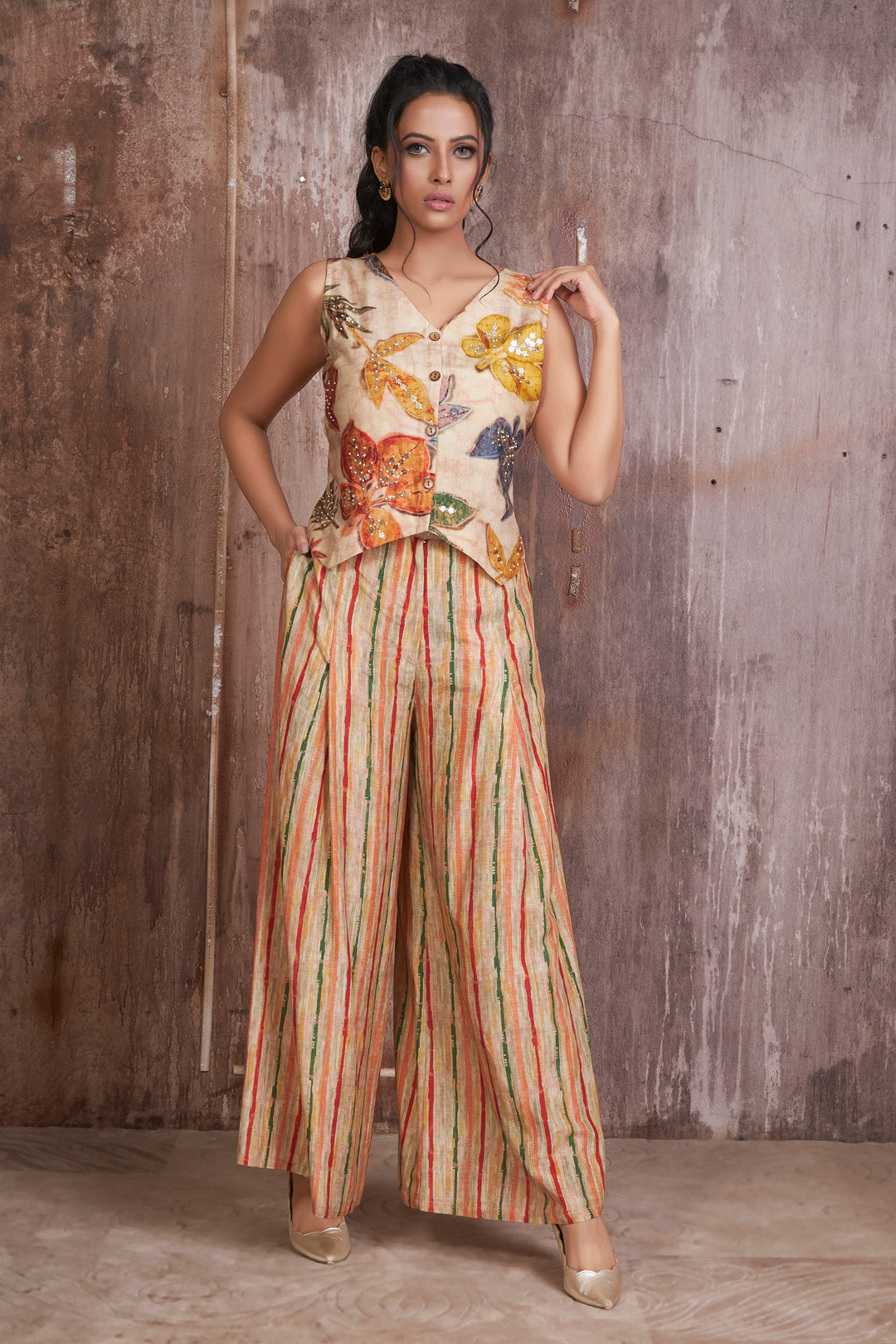 Silk linen floral digital print waist coat highlighted with hand embroidery teamed with striped palazzo